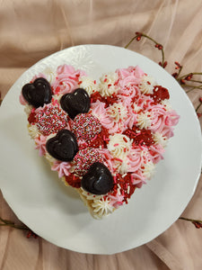 Heart cake, buttercream frosting, Valentine's cake, pink cake, pink sprinkles, cake with chocolates